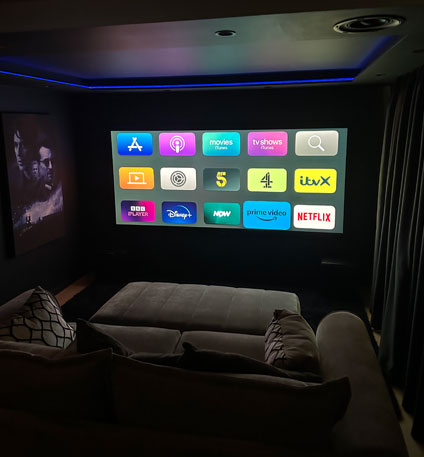 Luxury cinema room with 4K projector, Dolby Atmos sound system and automated seating in Bryanston, Johannesburg
